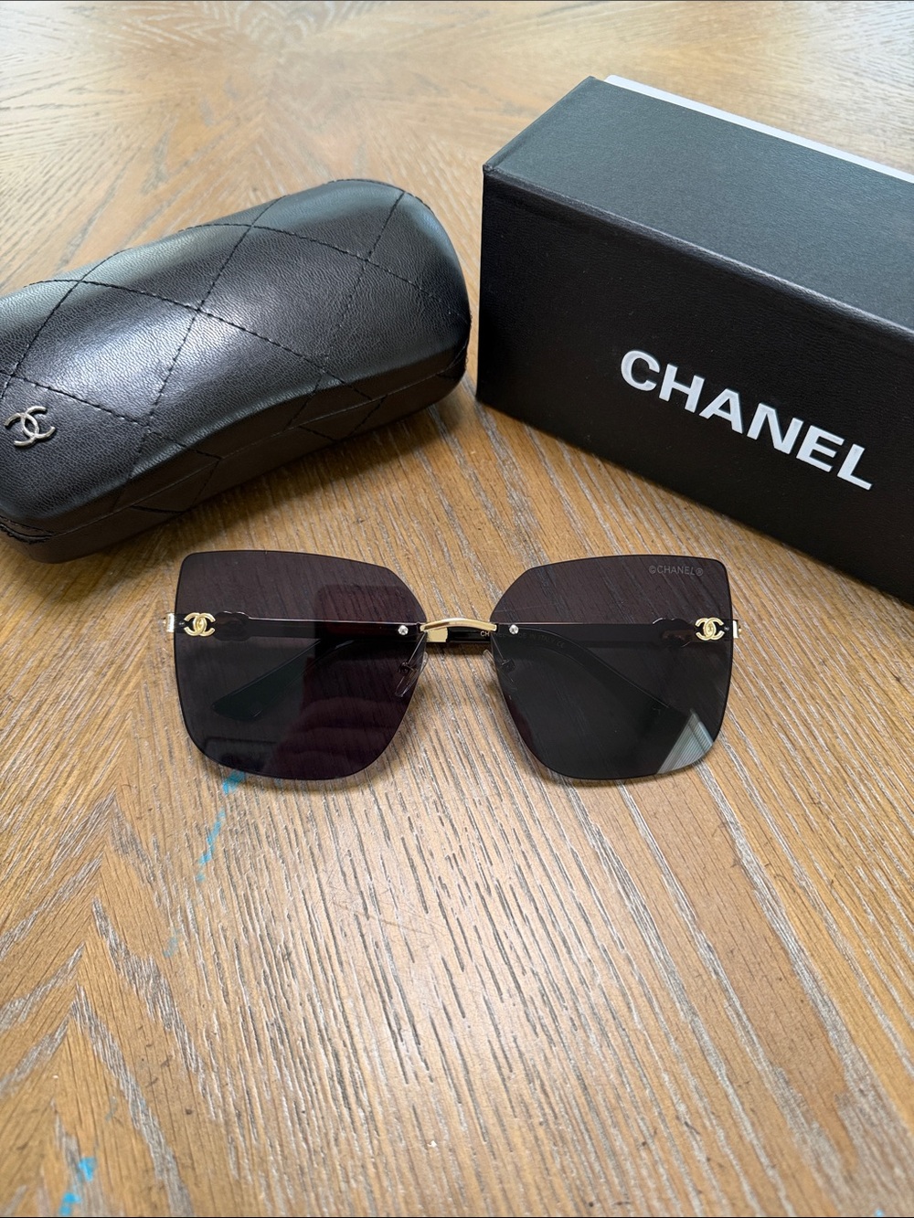CHANEL Black Gradient Rimless Square Sunglasses with Gold Accents